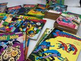 a bunch of comics are sitting on a table next to each other
