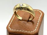 an image of a close up of a ring on top of a wooden box