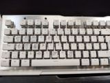 a close up of a computer keyboard on a desk