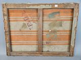 an old wooden frame with a painting of a man and a woman on it