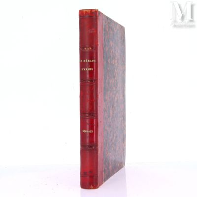a red book sitting on top of a white table