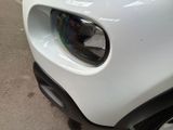 a close up of the front of a white car