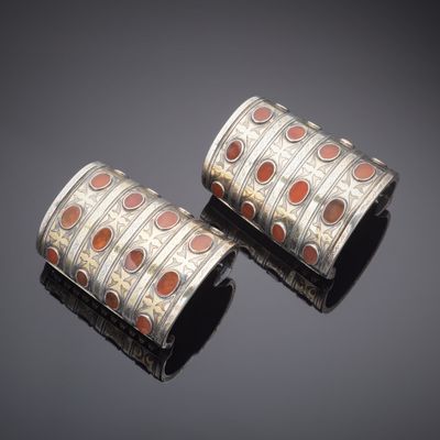 pair of silver and coral inlay cuff bracelets