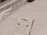 a pair of scissors sitting on a table next to a package