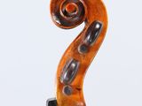 an old violin with a wooden bow on a white background