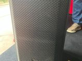 a close up of a speaker sitting on top of a table