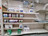 many bottles of cleaning products on the shelves in the store