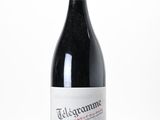a bottle of wine that is sitting on a table