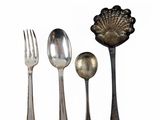 four spoons, a fork, and a spoon on a white background