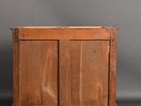 an old wooden cabinet sitting on top of a wooden floor