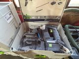 a box with tools in it sitting on the floor