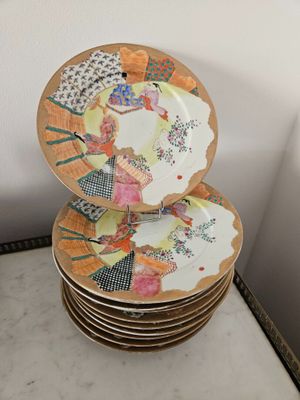 many plates stacked on top of each other on a table