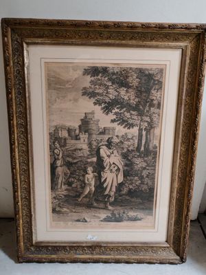une vieille photo représentant une femme et un enfant dans un décor boisé