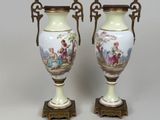 pair of antique porcelain vases with painted scenes on them
