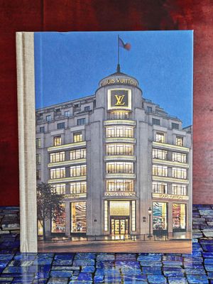 un livre sur lequel figure une photo d'un magasin Louis Vu