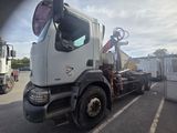 a white truck that is parked in a parking lot