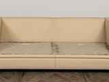 a couch that has a mattress on top of it