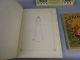 an open book with a drawing of a person on it next to a book with a drawing of a person on it
