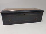 an old black wooden box with two drawers and two handles