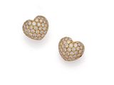 a pair of diamond heart earrings