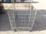 a metal shopping cart sitting on the side of the road