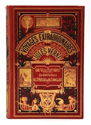 un livre rouge orné de lettres dorées et d'illustrations