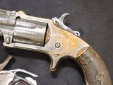 a gun that is sitting on a table next to a pair of handcuffs