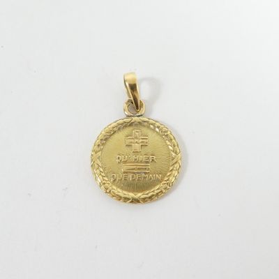 a close up of a gold coin on a white surface