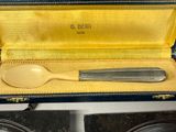 a spoon and a spoon rest in a case