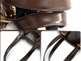 two pictures of a brown bag with a gold zipper