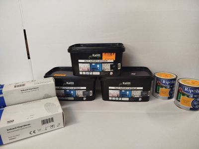 several containers of paint are sitting on a shelf next to a box of paint