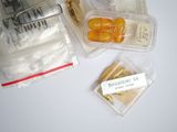 many different types of food in plastic containers on the table