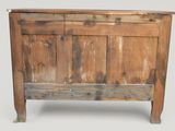 an old wooden cabinet with a door on top of it
