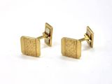 pair of gold plated cufflinks with a square design