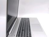 a laptop computer that is sitting on a white surface
