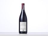 a bottle of wine that is sitting on a table