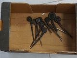 four pairs of scissors in a box on the floor