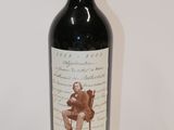 a bottle of wine that is sitting on a table