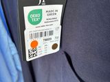 a label on a blue jacket that says demo tex