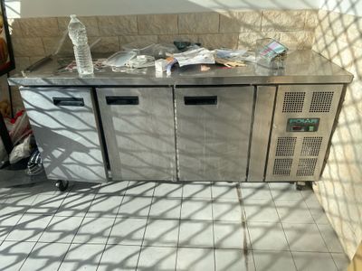 an image of a commercial kitchen with a stainless steel counter top