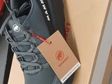 a pair of shoes on a box with a price tag