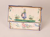 a small box with a picture of a woman on it