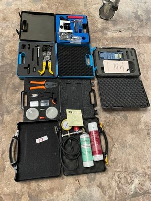 many different tools in the case on the floor