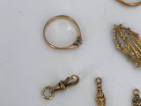 many different types of jewelry on a white surface