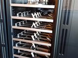 an image of a wine cooler with many bottles