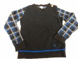 black sweater with blue and white plaid sleeves on a white background