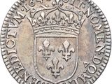 a close up of a coin with a crown on it