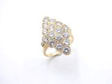 a close up of a diamond ring on a white surface