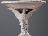 a statue of an angel on a pedestal on a table