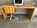 a desk with a computer on top of it